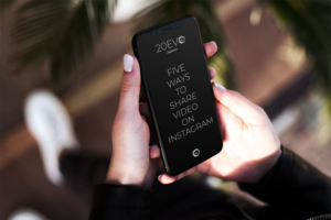 someone holding a phone with a graphic that says 20EVO 5 ways to post video on Instagram