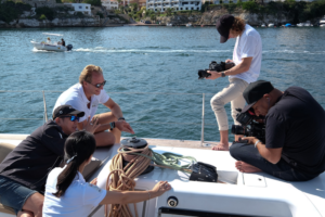Bhushan Thakkar of 20EVO directing a corporate video shoot in Menorca Spain while on a sailboat