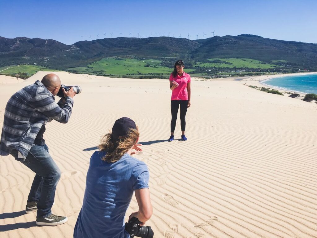 Behind the scenes of shoot in spain with woman in pink shirt in the background