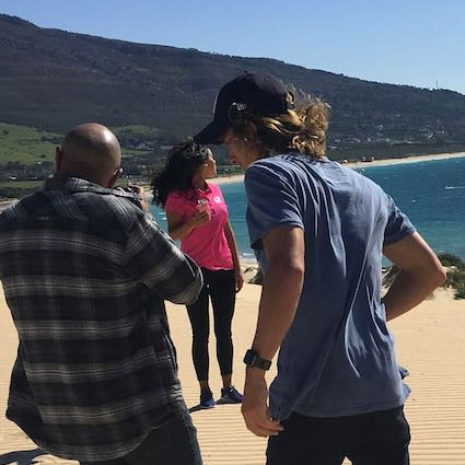 Behind the scenes of shoot in spain with woman in pink shirt in the background
