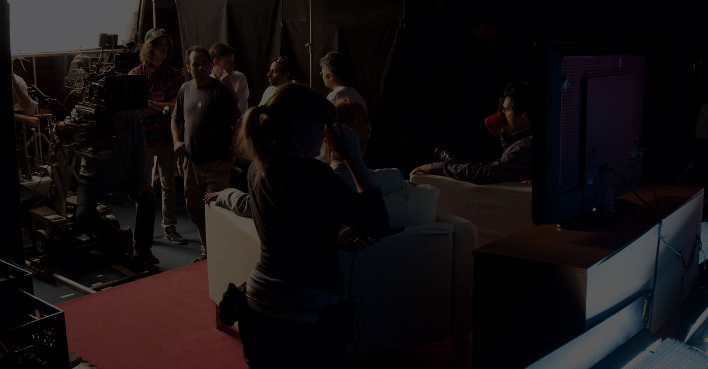Movie set with actors and camera operators and directors in the background